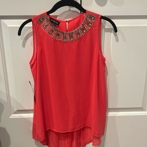 Never worn Bebe bright pink beaded neckline blouse